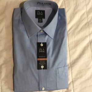 Never worn, Medium Blue Jos A Bank Dress Shirt